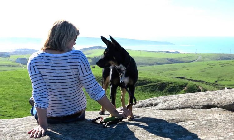 author frances rivetti and her dog rosie overlooking the northern california coastline